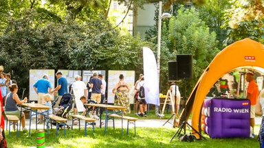 Photo of People in a park. The text reads: Vienna
