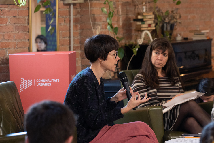 Photo of a scholar speaking into a microphone