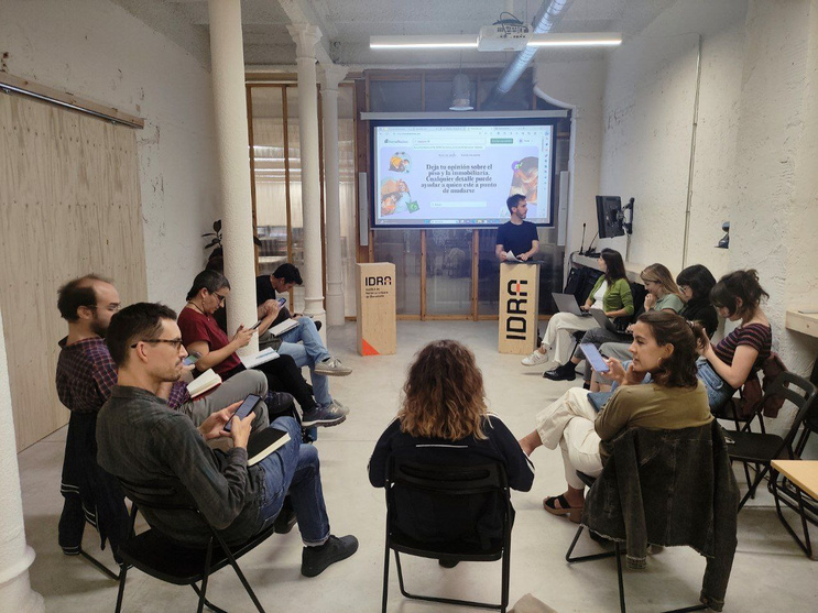 Photo of Researchers sitting in a circle during a workshop